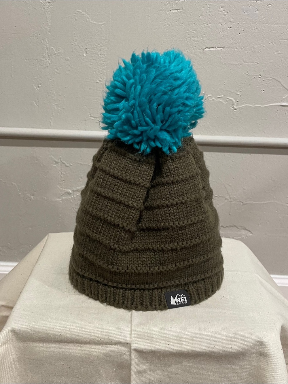 REI Olive Green Knit Beanie with Bright Teal Pom